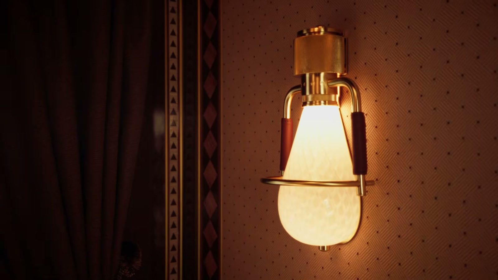 A brass wall lamp in a train suite